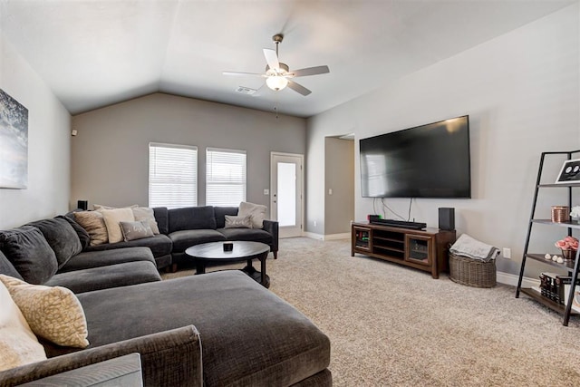 living room with ceiling fan, lofted ceiling, and light carpet