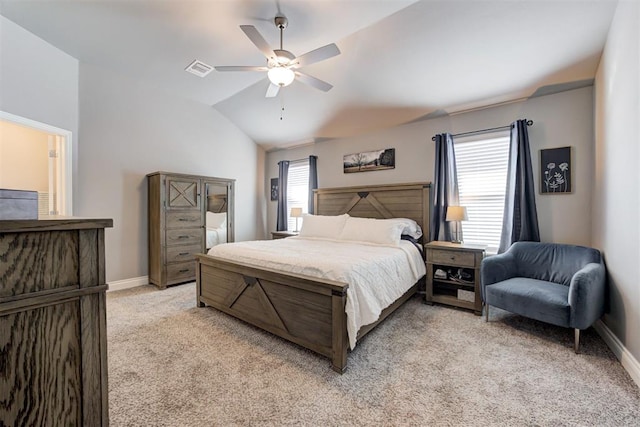 bedroom with vaulted ceiling, ceiling fan, and light colored carpet