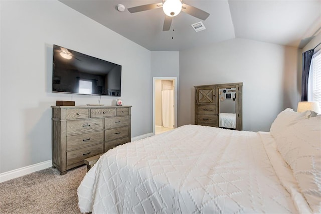 bedroom with ceiling fan, lofted ceiling, and light colored carpet