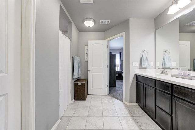 bathroom featuring vanity and tile patterned flooring