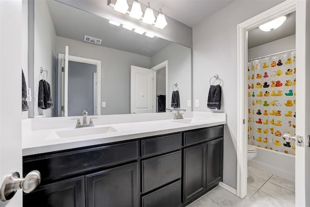 full bathroom with vanity, tile patterned floors, toilet, and shower / tub combo with curtain