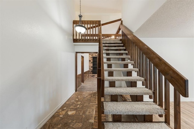 9718 Hummingbird Ln, Oklahoma City, OK 73162 - staircase with a textured ceiling