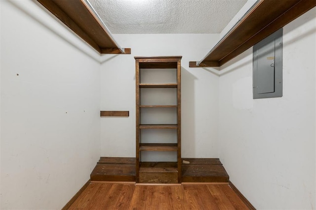 9718 Hummingbird Ln, Oklahoma City, OK 73162 - spacious closet featuring dark hardwood / wood-style floors and electric panel