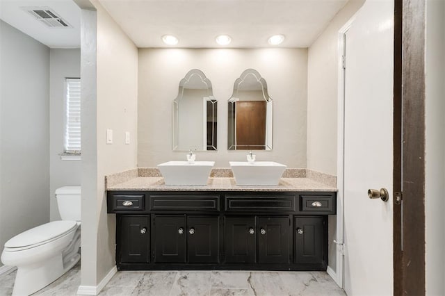 9718 Hummingbird Ln, Oklahoma City, OK 73162 - bathroom featuring vanity and toilet