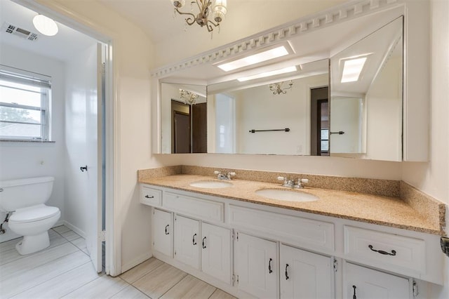 9718 Hummingbird Ln, Oklahoma City, OK 73162 - bathroom with vanity and toilet