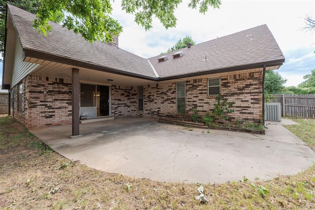 9718 Hummingbird Ln, Oklahoma City, OK 73162 - rear view of property with cooling unit and a patio area