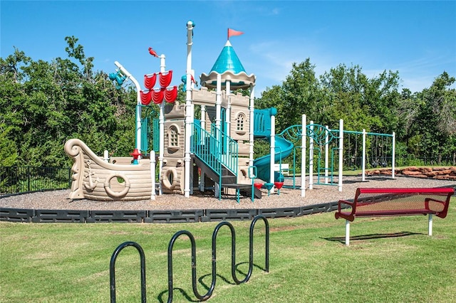 view of jungle gym featuring a lawn