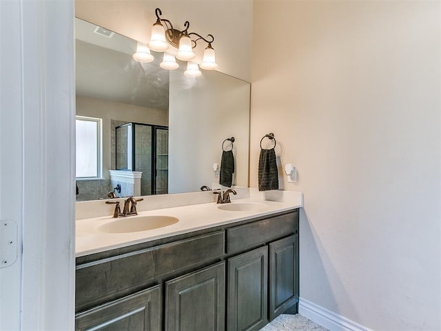 bathroom with vanity and a shower with shower door