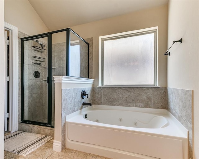 bathroom featuring vaulted ceiling and separate shower and tub