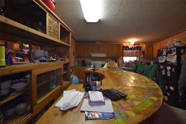 dining area with a textured ceiling