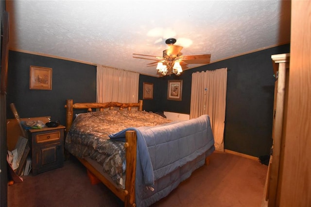 carpeted bedroom with a textured ceiling, ornamental molding, and ceiling fan