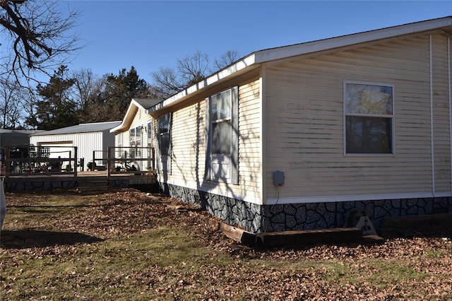 view of side of home featuring a deck