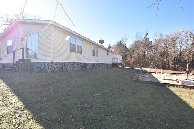 view of property exterior featuring a lawn