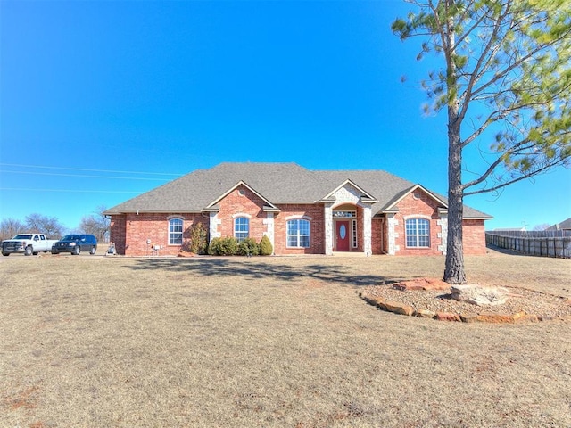 ranch-style house with a front lawn