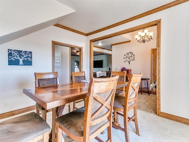 dining area featuring crown molding, light colored carpet, and an inviting chandelier