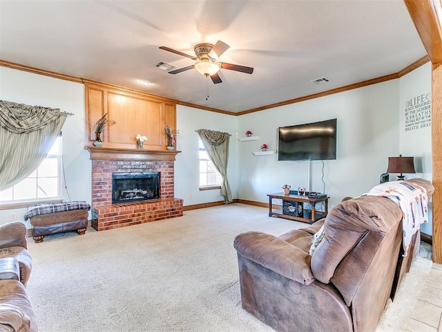 living room featuring crown molding, a brick fireplace, light colored carpet, and ceiling fan