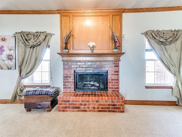 carpeted living room featuring crown molding and a fireplace