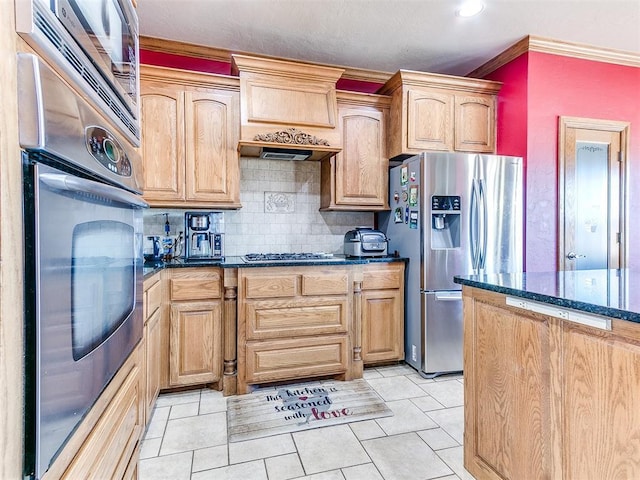 kitchen with crown molding, dark stone countertops, stainless steel appliances, decorative backsplash, and exhaust hood