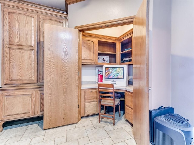 tiled home office featuring built in desk