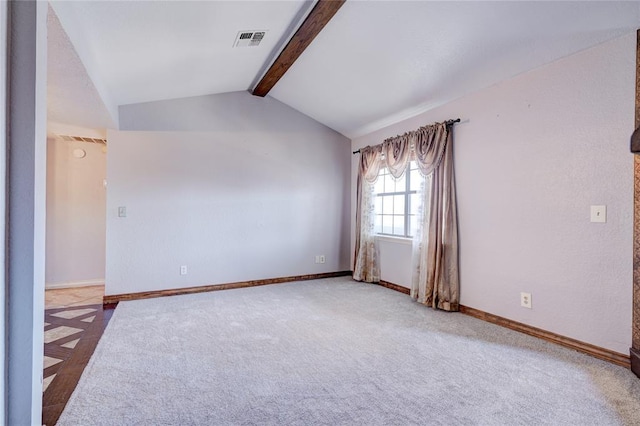 carpeted empty room featuring vaulted ceiling with beams