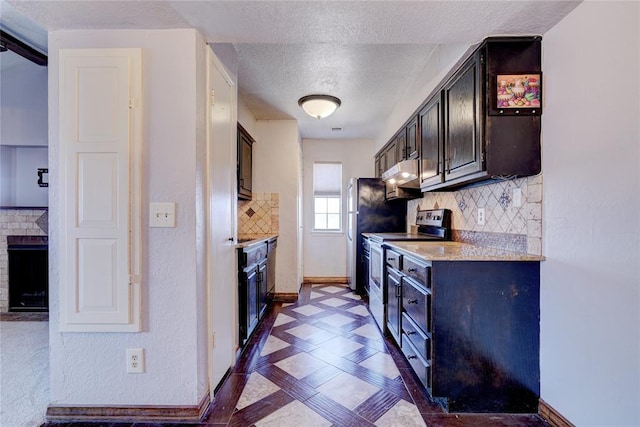 kitchen with backsplash, dark brown cabinets, a fireplace, a textured ceiling, and stainless steel electric stove