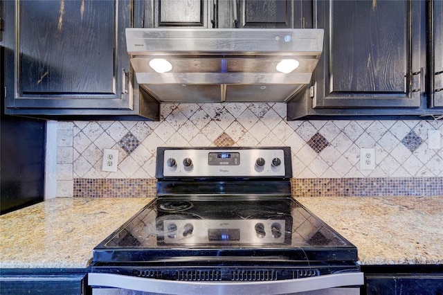 kitchen with light stone counters, backsplash, electric range, and exhaust hood