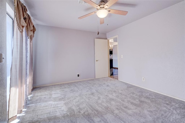 carpeted empty room with ceiling fan