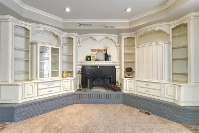 unfurnished living room featuring ornamental molding and carpet