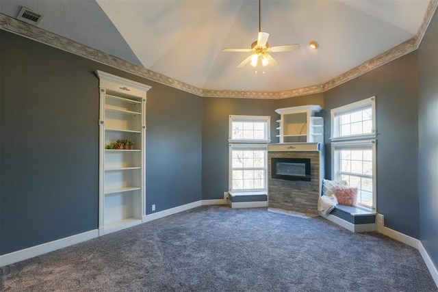 unfurnished living room with lofted ceiling, carpet flooring, built in features, and ceiling fan