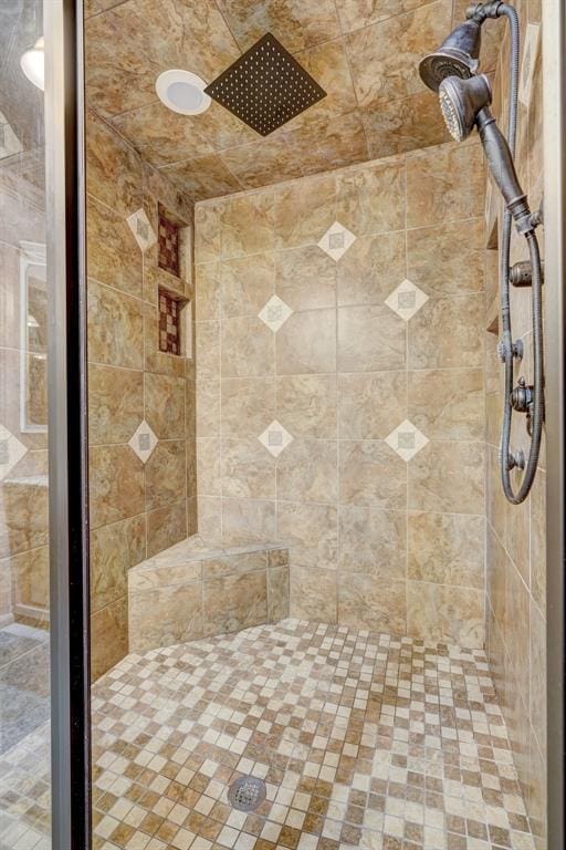 bathroom with a tile shower