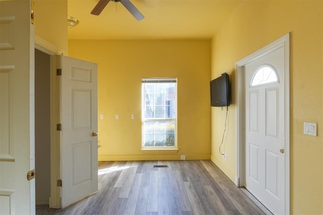 entryway with hardwood / wood-style flooring and ceiling fan