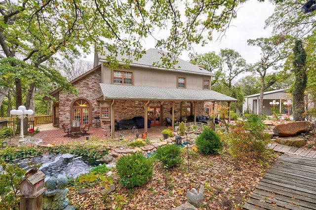 back of property featuring a patio area and french doors