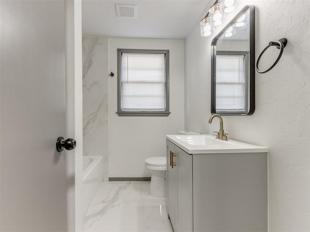 bathroom with vanity and toilet