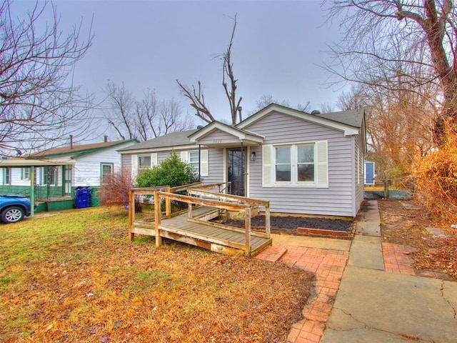 view of front of property with a wooden deck