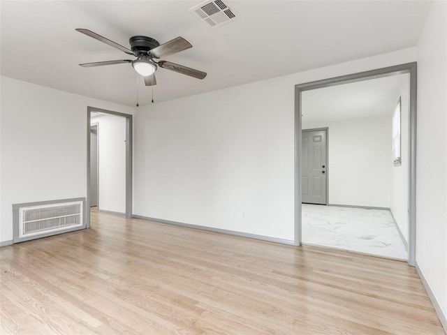 unfurnished room with light hardwood / wood-style floors and ceiling fan