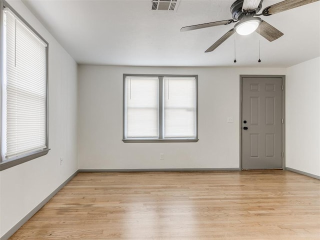 unfurnished room featuring light hardwood / wood-style flooring and ceiling fan