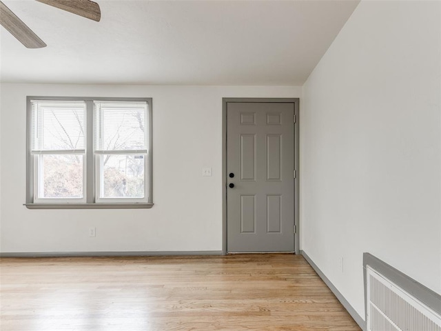 foyer featuring ceiling fan and light hardwood / wood-style floors