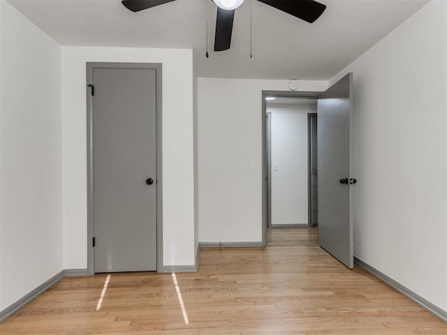 unfurnished bedroom featuring light hardwood / wood-style floors and ceiling fan