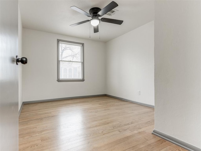 unfurnished room with ceiling fan and light hardwood / wood-style floors