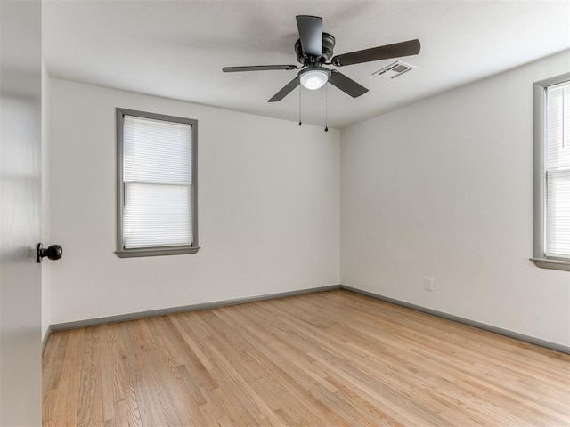 unfurnished room with ceiling fan and light hardwood / wood-style flooring