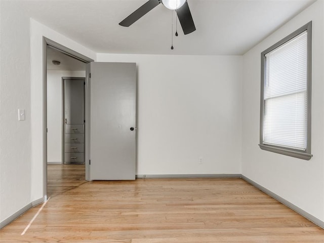 unfurnished room featuring ceiling fan and light hardwood / wood-style floors