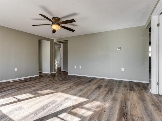 unfurnished bedroom featuring dark hardwood / wood-style floors and ceiling fan