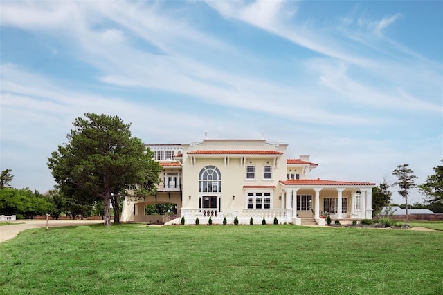 back of house with a pergola and a lawn