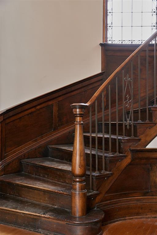 staircase featuring hardwood / wood-style floors