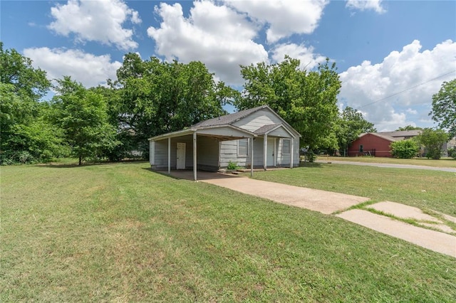 exterior space featuring a carport and a front yard