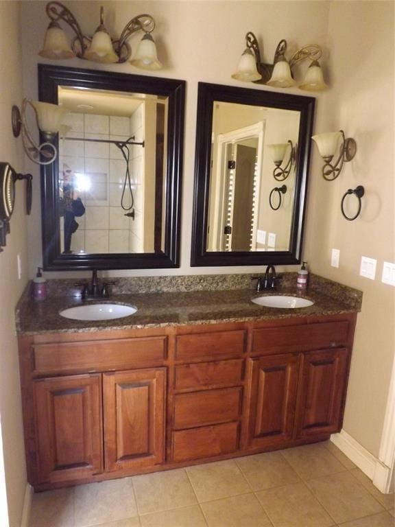 bathroom with vanity, tile patterned floors, and walk in shower