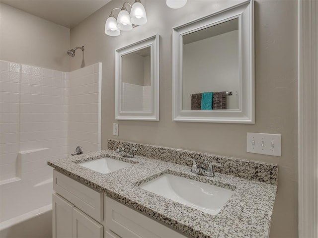 bathroom with shower / bathtub combination and vanity