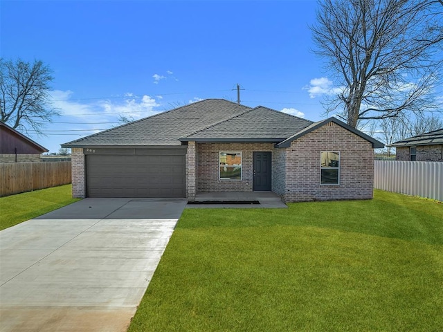 502 E Hudson St, Lexington, OK 73051 - ranch-style home featuring brick siding, roof with shingles, a garage, and driveway