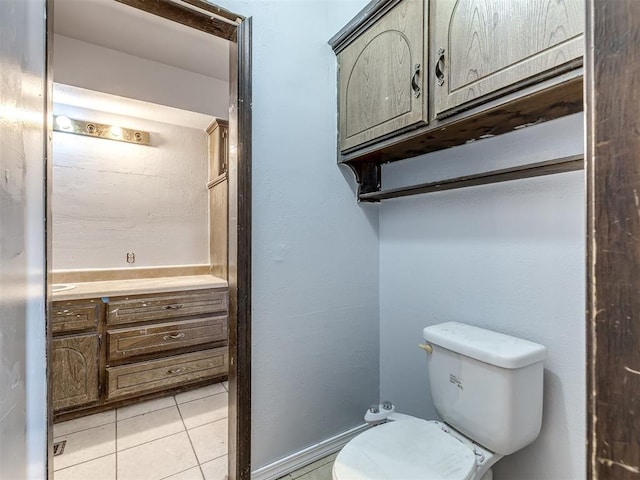 bathroom featuring tile patterned floors and toilet