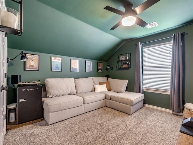 living room with lofted ceiling and ceiling fan